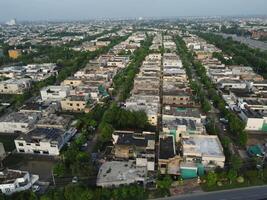 View at city from bird sight. City from drone. Aerial photo. City scape from drone on 2023-07-22 in Lahore Pakistan photo