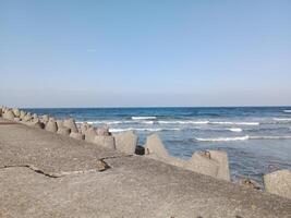 Taking a stroll along the port and pier in Kolobrzeg, Poland, offers a delightful experience with picturesque views of the Baltic Sea and the bustling maritime activity. photo