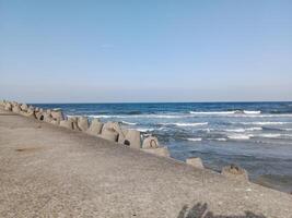 Taking a stroll along the port and pier in Kolobrzeg, Poland, offers a delightful experience with picturesque views of the Baltic Sea and the bustling maritime activity. photo