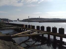 Taking a stroll along the port and pier in Kolobrzeg, Poland, offers a delightful experience with picturesque views of the Baltic Sea and the bustling maritime activity. photo