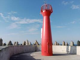 Taking a stroll along the port and pier in Kolobrzeg, Poland, offers a delightful experience with picturesque views of the Baltic Sea and the bustling maritime activity. photo