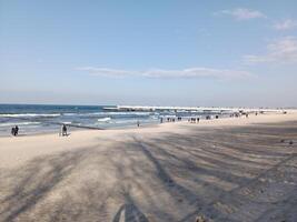 Taking a stroll along the port and pier in Kolobrzeg, Poland, offers a delightful experience with picturesque views of the Baltic Sea and the bustling maritime activity. photo