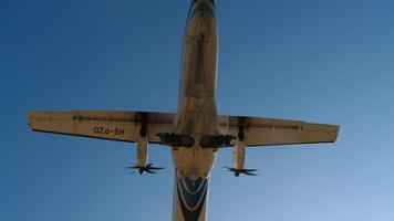 PHUKET, THAILAND - JANUARY 23, 2023. Passenger plane Bangkok Airways ATR 72-600, HS-PZD flies overhead on the landing at Phuket airport , HKT. Tourism and travel concept video