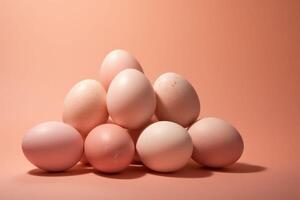 AI generated A pyramid of speckled eggs in shades of peach fuzz on a matching background, suggesting simplicity and potential.. idea for Easter poster photo