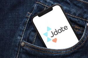 KYIV, UKRAINE - FEBRUARY 23, 2024 Jdate logo of famous dating website or app on iPhone display photo