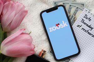 KYIV, UKRAINE - FEBRUARY 23, 2024 Zoosk logo of famous dating website or app on iPhone display photo