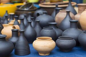 Clay vessels of different colors. Ceramics photo