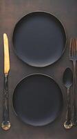 AI generated Mealtime elegance Top view of black plate with utensils Vertical Mobile Wallpaper photo