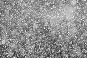 Falling Snowflakes on a Black Background, Enhance Your Project with Snowy Texture. Use as a 'Screen' Layer in Photo Editor for Effortless Snow Integration.