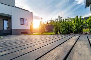 Beautiful modern house. Concrete out-to-date building. View from the garden. photo