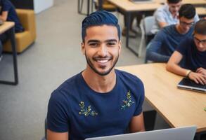 AI Generated A focused student with styled hair smiles at the camera in a classroom. His navy blue shirt and casual demeanor make him appear approachable and dedicated. photo