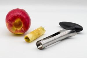 Apple corer. Tool for removing the apple core on white background. photo