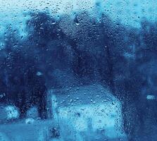 Water drops on glass, closeup natural texture photo