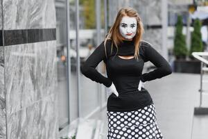 The girl with makeup of the mime. improvisation. mime shows different emotions photo