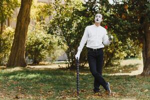 Portrait of a man, artist,clown, MIME. Shows something. Mime actor shows different emotions. photo