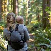 AI generated Quiet walks in nature baby in a carrier photo