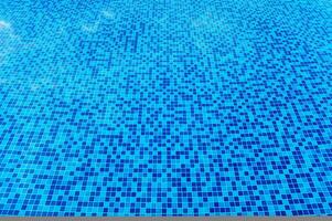 Abstract view of bottom caustics of swimming pool with ripple... photo