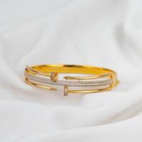 nail-shaped gold bracelet jewelry photo