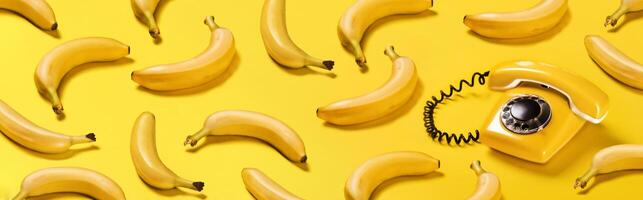 Banner bananas and old yellow phone with hard shadows pattern on yellow background bananaphone photo