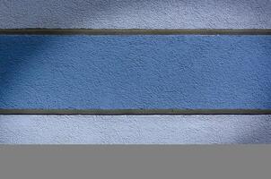 plastered wall painted with stripes. background . space for text1 photo