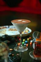 Table Adorned With Glasses Filled With a Variety of Refreshing Drinks. photo