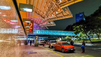 Mexico City Mexico 2022 Airport outside Street Building People at night in Mexico City Mexico. photo