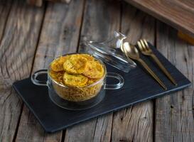 balalet or balaleet served in a dish isolated on cutting board side view of breakfast on wooden background photo