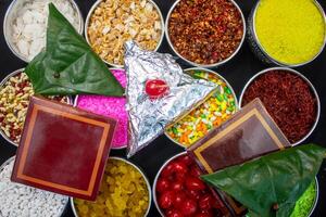 Indian paan shop set ingredients nuts top view with betel leaf photo