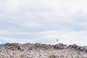 land with garbage, Garbage dump landscape of ecological damage contaminated land., plastic scrap in landfill, environmental problems pollution, waste or trash from household in waste landfill photo