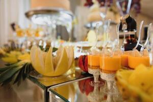 Delicious sweets on wedding candy buffet with desserts, cupcakes,tiramisu and cookies photo