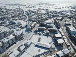 Top view from a drone of a snowy city. Sarikaya,Yozgat,Turkey photo