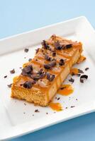 Dessert Dulce De Leche Cheesecake served in a dish isolated on background side view of fastfood photo