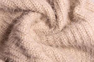 blanco prendas de punto textura. suave textura de hecho en casa cachemira lana suéter. foto