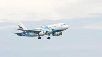 PHUKET, THAILAND - NOVEMBER 27, 2017. Airbus A319-132, HS-PGT of Bangkok Airways approaching for landing, descending to Phuket airport, side view. Airliner flies video