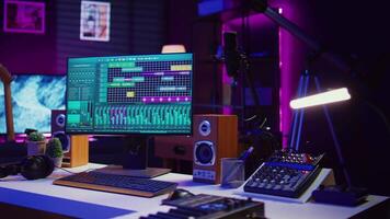 Empty creative space recording tunes and soundtracks with electronic tools, mixing and mastering in music industry. Home studio working with audio effects on songs, acoustics. Camera B. video