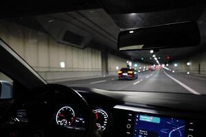 Warsaw, Poland - March 10th, 2024 - Driving a Car in Ursynow Tunnel photo