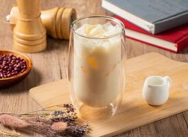 pure soy milk served in bowl isolated on table top view of asian food photo