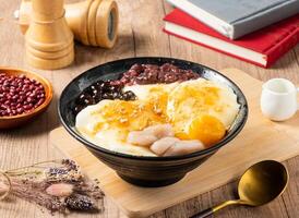 Zainaco grass jelly, mango, red beans and rice ball served in bowl isolated on table top view of asian food photo