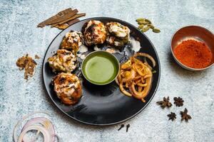 Chicken Mix tikka Kabab with reshmi, malai, green, haryali kebab and chili sauce served in a dish isolated on grey background top view of bangladesh food photo