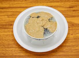 Kulfi falooda served in plate isolated on table top view of indian and pakistani sweet food photo