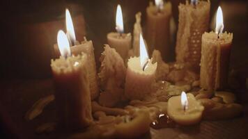 Smoke floats over burning wax candles video