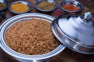 Bashawer Rice, mandi, biryani with fried onion served in dish isolated on table top view of arabic food photo