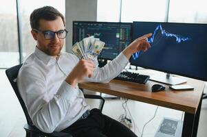 Serious business man trader analyst looking at computer monitor, investor broker analyzing indexes, financial chart trading online investment data on cryptocurrency stock market graph on pc screen. photo
