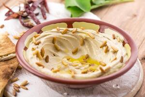 hummus plate served in dish isolated on table side view of arabic food photo