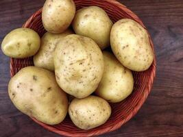 Potatoes on wooden background video