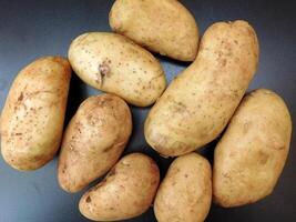 Potatoes on wooden background video