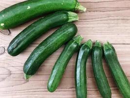 Courgettes on wooden background video