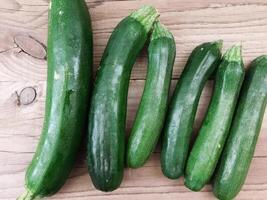 Courgettes on wooden background video