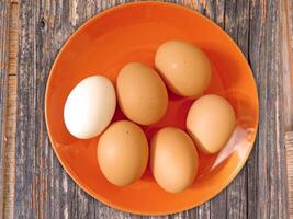 Eggs on wooden background video