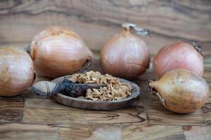 roasted onions on olive wood photo